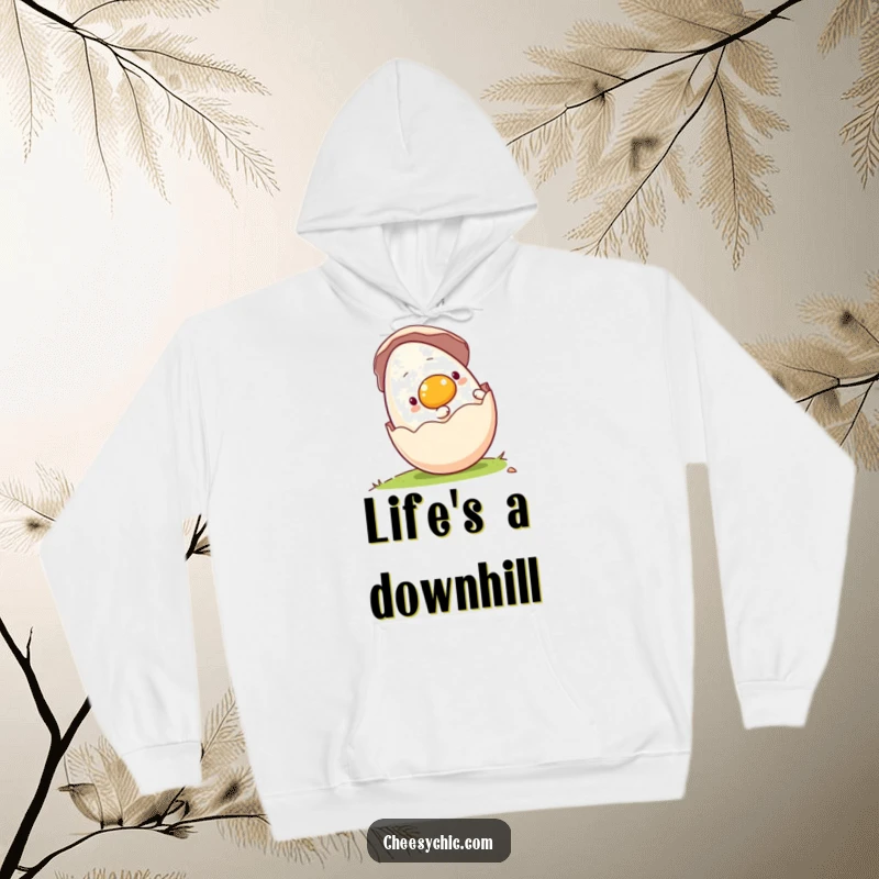 Funny hoodie featuring a happy anthropomorphic egg rolling downhill in its shell, offering warmth and whimsical adventure.
