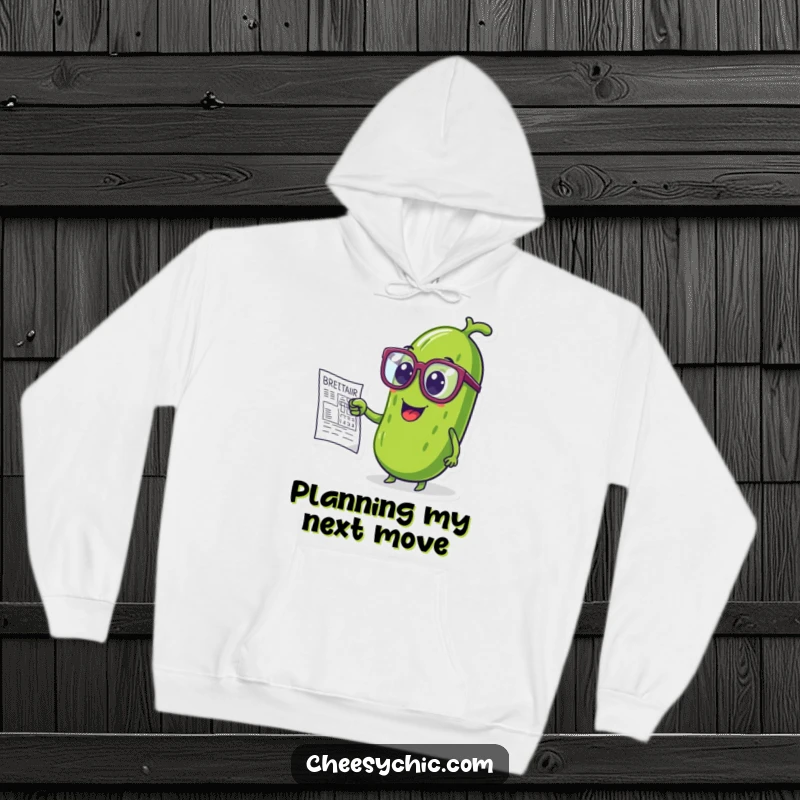 Funny hoodie depicting a pickle wearing oversized glasses, intently studying a complex blueprint.
