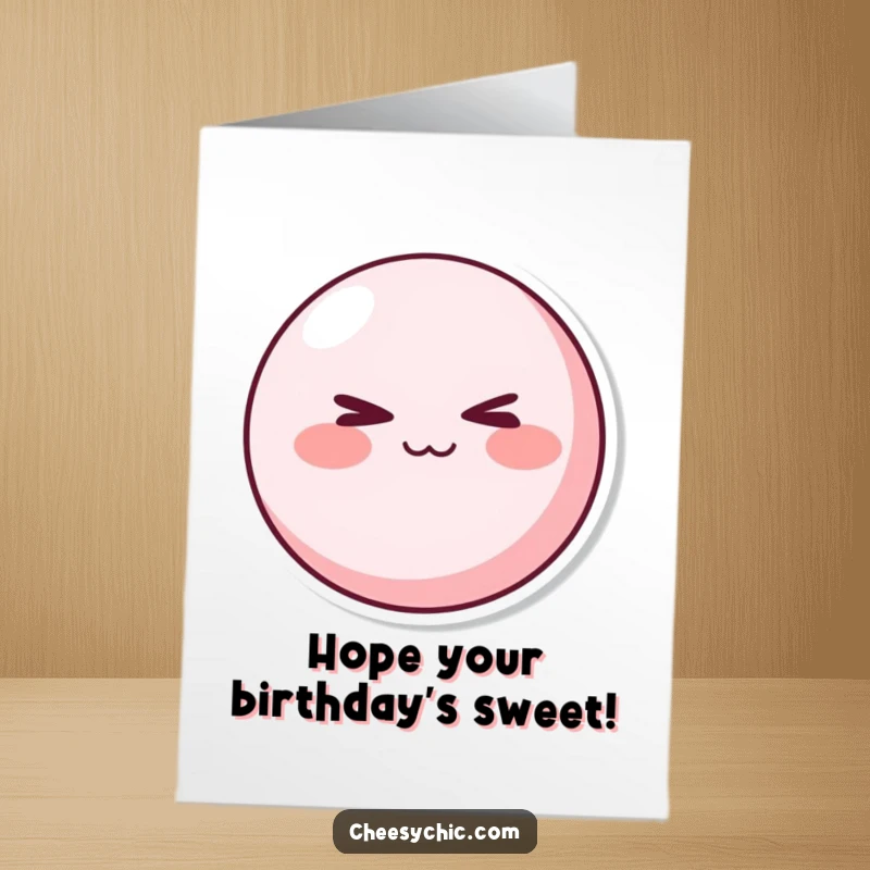 Funny Free Printable Birthday Card: A cute pink character with rosy cheeks winking with a playful, mischievous expression.